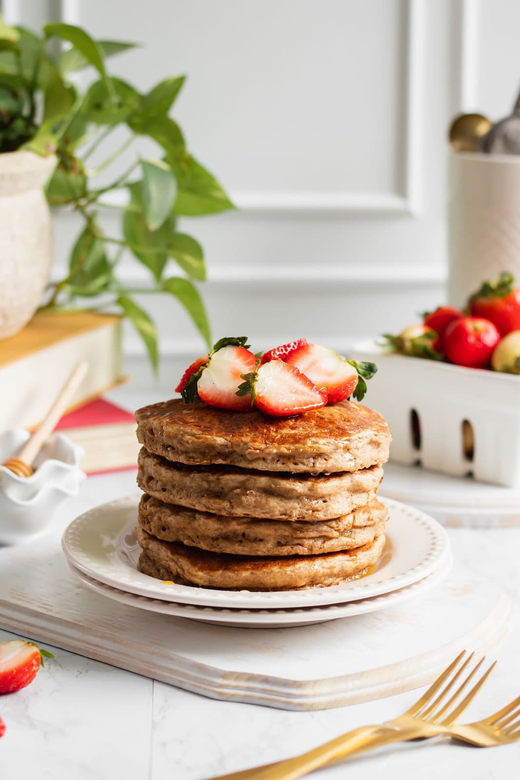 fluffy vegan banana oat pancakes with maple syrup
